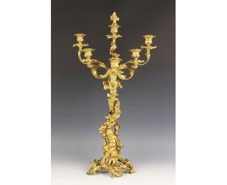 A French Rococo influence ormolu six branch candelabrum, 19th century, the branches set out as a descending V, the base model