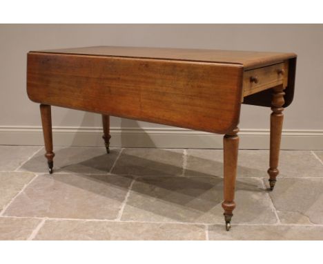 A Victorian mahogany Pembroke table, the rounded rectangular drop leaf top above a pair of opposing frieze drawers, upon bobb