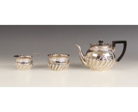 A Victorian three piece silver bachelors tea service, Josiah Williams & Co, London 1890, comprising a teapot, sugar bowl and 