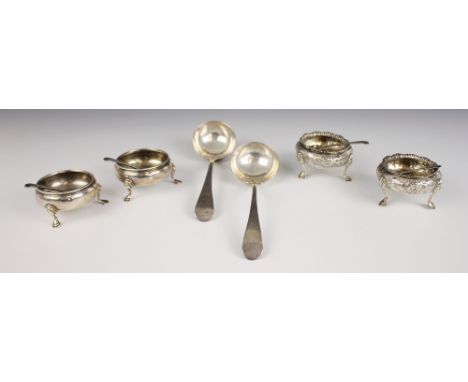A pair of Victorian silver cauldron salts, Henry Holland, London 1852, the shell cast rim above an embossed and engraved flor