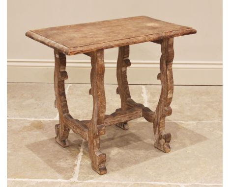 An Arts and Crafts 'Tuscan' style limed pine occasional table, in the manner of Sir Robert Lorimer, the rectangular moulded t