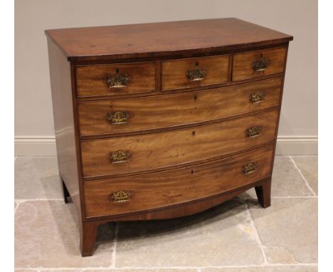 An early 19th century mahogany bowfront chest of drawers, formed from three short and three long graduated and cock beaded dr