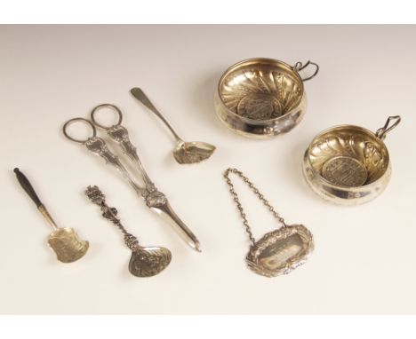 A George III silver caddy spoon, marks for 'TP', London 1794, the shell shaped bowl with embossed floral decoration, leading 