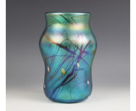 A John Ditchfield for Glasform studio glass vase of waisted form, the iridescent green glass punctuated by brightly coloured 