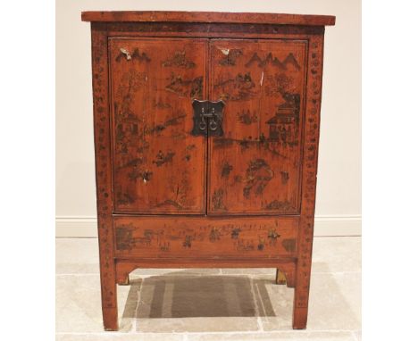 A red lacquer Chinese wedding cabinet, 20th century, probably elm, the twin doors adorned with figures in a pagoda landscape,