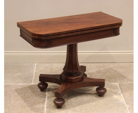 A mahogany tea table, mid 19th century, the rounded rectangular folding top above a frieze applied with beading, raised upon 
