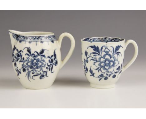 A Caughley porcelain robin’s beak milk jug, circa 1775, painted in underglaze blue with the Peony pattern below a lunette bor
