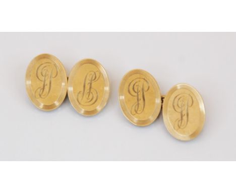 A pair of 9ct gold cufflinks, designed as two oval discs joined by a curb link chain, monogrammed initials and engine turned 