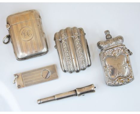 A George V silver vesta case, Chester 1912, the rectangular body with engine turned decoration and central initial monogramme