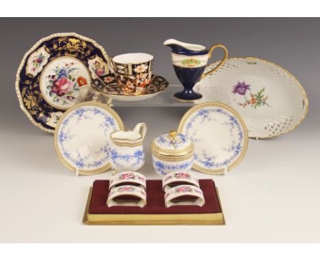 A Royal Worcester part cabaret set, comprising a sucrier and cover, a milk jug and two saucers, decorated in blue with traili