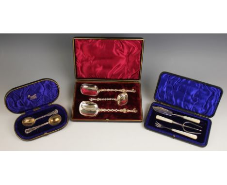 A cased pair of Victorian silver bouillon spoons, Lee &amp; Wigfull, Sheffield 1895, with embossed scrolling foliate borders 