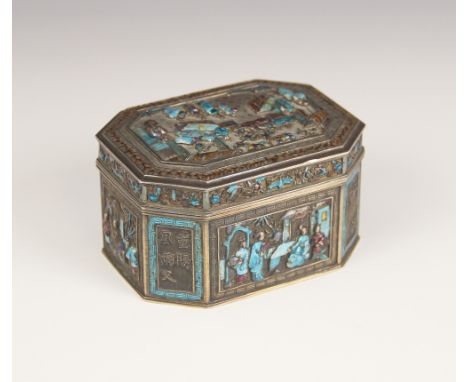 A Chinese silver and enamel box, 19th century, possibly Canton, the canted rectangular box decorated in relief with enamelled