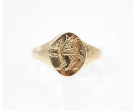 A 9ct gold signet ring, the central oval cartouche depicting a Welsh dragon, leading to tapered shoulders and plain polished 
