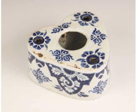 A Delft tin-glazed blue and white inkwell, 18th century, of heart form with central ink-well surround by three quill aperture