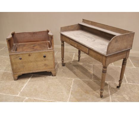 An early 19th century pine tray top washstand, applied with simulated ebony stringing, the galleried top with rear shelf abov