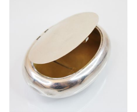 A George V silver snuff/tobacco box, Stokes &amp; Ireland Ltd, London 1913, the oval body of plain polished form with compres