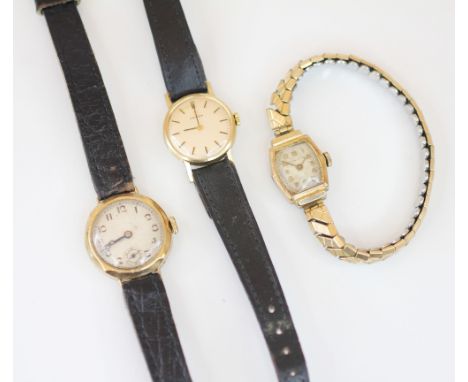 A ladies vintage 9ct gold Omega wristwatch, the circular champagne coloured dial with baton markers, set to a plain polished 