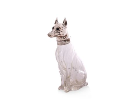 A NOVELTY SILVER PLATE MOUNTED GLASS DOG FORM DECANTER
Continental Europe, Circa 1900, modelled as a Pinscher, the silver pla
