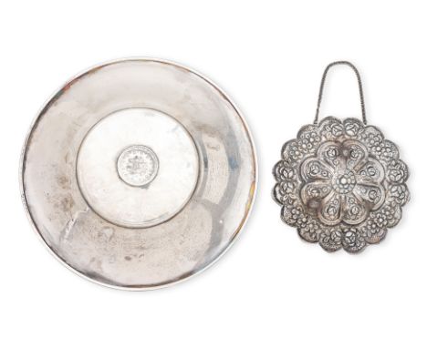 A TURKISH SILVER DISH AND SILVER OVERLAY MIRROR
The circular dish with central mounted silver Ottoman 20 kurus coin, narrow f