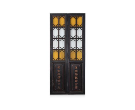 A PAIR OF LARGE GLAZED AND LACQUERED DOOR OR SCREEN PANELS
The upper portion set with moulded yellow and clear glass panels, 