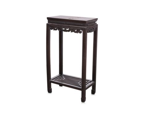 A CARVED RECTANGULAR SIDE TABLE
With carved an pierced frieze and lattice undertier
86 x 48 x 27cm
Condition Information: Som