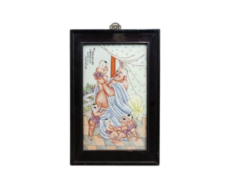 A FAMILLE ROSE PORCELAIN PLAQUE OF BUDAI AND BOYS
20th Century, with inscription and seal marks to upper right, in hardwood f