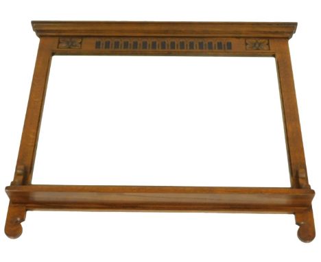 An early 20thC overmantel mirror, the top with a moulded edge above a rosette and arched carved frieze, rectangular bevelled 