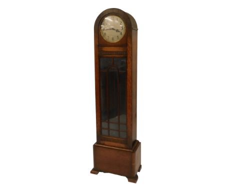 A 1920s oak cased longcase clock, the circular silvered dial bearing Arabic numerals, chain driven, the case with a domed top