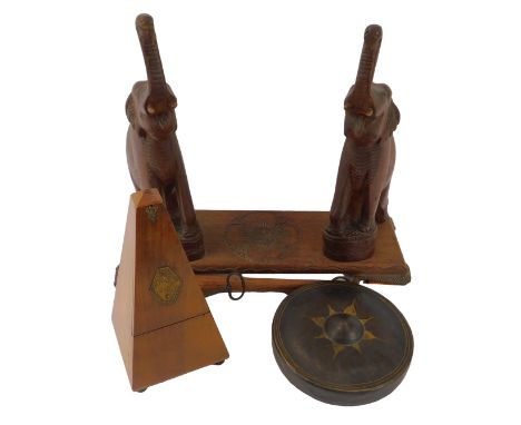 A 20thC walnut cased metronome de Maelzel, on compressed bun feet, 22.5cm high, together with an Eastern dinner gong, with ci