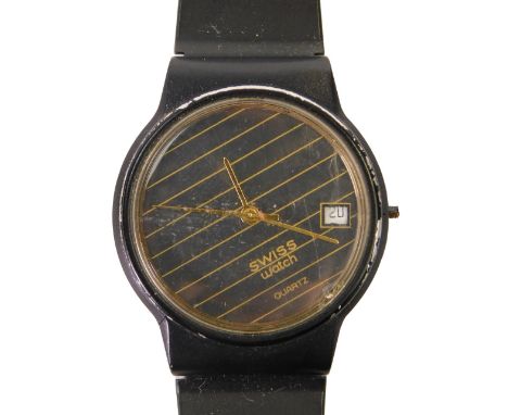 A Swatch Swiss watch, with quartz movement, with black striped dial with gold hands and seconds dial, on a rubbed black strap