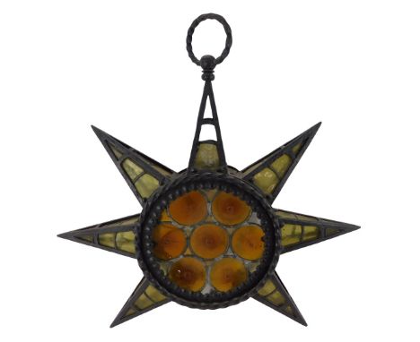 An Eastern wrought iron framed light fitting, of star form with stained glass panels, 63cm high. (AF)