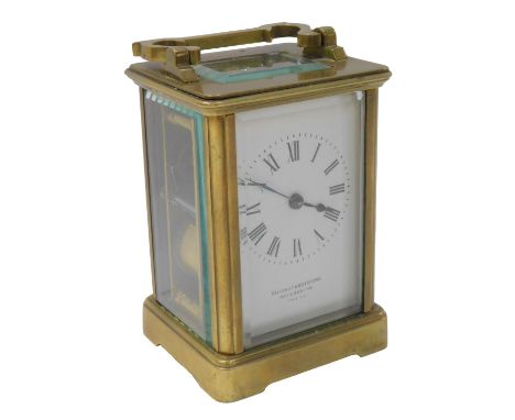 A 20thC brass cased carriage clock, the rectangular white enamel dial bearing Roman numerals for Ollivant &amp; Botsford Manc