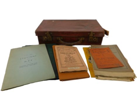An early 20thC brown pressed leather suitcase, containing a list of stations and a map of London, Midland &amp; Scottish Rail