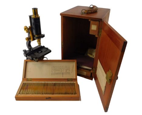 A W Watson and Sons Ltd Service microscope, number 44720, 32cm high, in a teak case, together with a teak case containing var