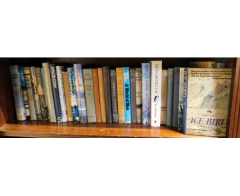 A group of Antarctic and snow adventure books and reference guides, including Polar Aviation, Shackleton, Big Dead Place, 90 