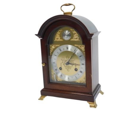A mahogany cased mantel clock, the brass dial with silvered chapter ring bearing Roman and Arabic numerals for Comitti of Lon