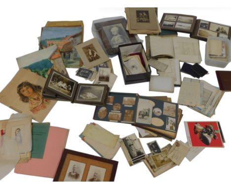 An Antler mid century suitcase containing Victorian and later photographs, some in albums to include professional portrait ph