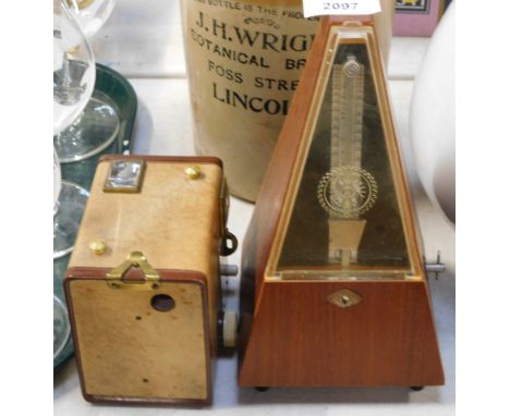 A German mahogany cased metronome, 23cm high, together with a Kodak Brownie Flash B box camera. (2)