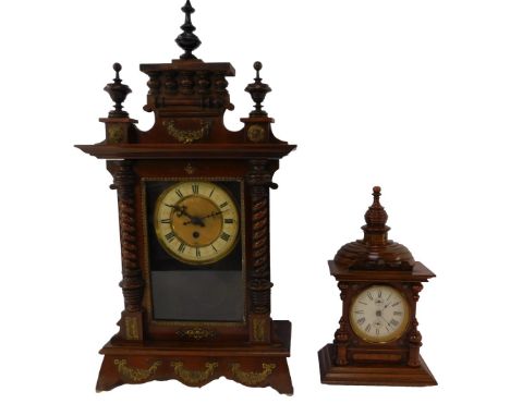 A late 19th/early 20thC mahogany cased mantel clock, the brass circular dial with cream enamel chapter ring bearing Roman num