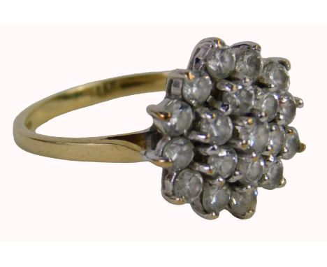 A 9ct gold cluster ring, set with a two row halo of cz stones, each claw set, in white gold setting, on a yellow metal band, 