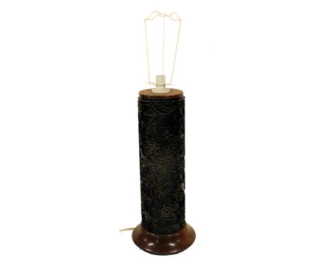 A table lamp, the column formed from a vintage wallpaper roller, on a circular flared wooden base, 65cm high including fitmen