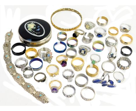A group of modern dress rings, and an enamel swallow white metal pill box. (a quantity)
