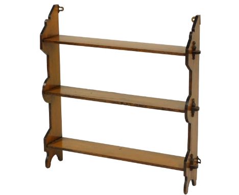 A late Victorian mahogany three tier hanging wall shelf, 55cm high, 65cm wide, 13cm deep. 