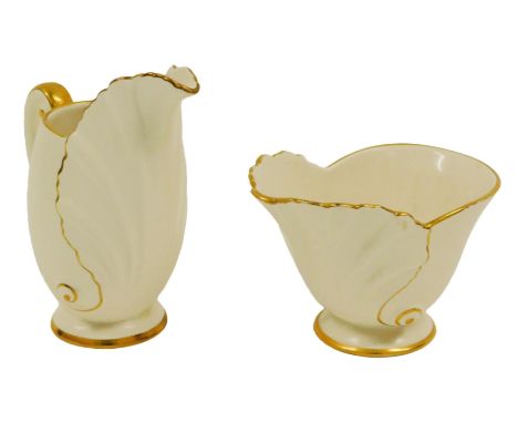 A Carltonware porcelain jug, with moulded Acanthus leaf decoration, against a cream ground, gilt heightened, printed marks, 1