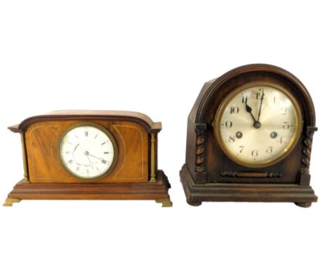 An Edwardian mahogany and line inlaid mantel clock, the white circular enamel dial bearing Roman numerals, key wind, the case