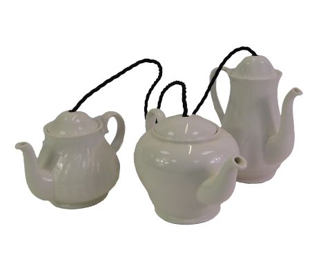 A BTC light fitting, with three porcelain drop pendants formed as teapots.