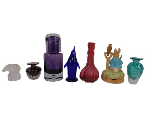 A group of coloured glassware, to include a purple glass carafe and glass, 21cm high, a Nachtmann frosted glass figure of a h