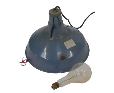 A blue enamel industrial light fitting, of circular tapering form, 48cm diameter, together with an additional light bulb.WARN