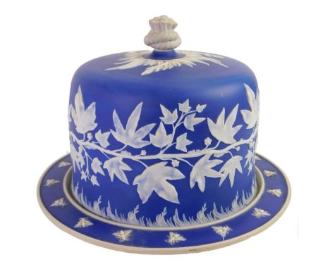 A 19thC Dudson pottery Stilton dish and cover, the lid with a twisted rope knop, and ivy decoration against a dark blue groun