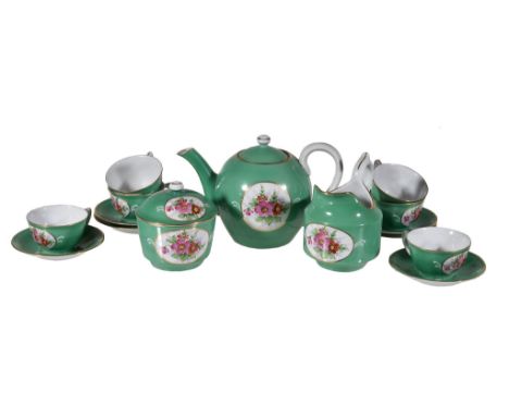  A Moscow porcelain (Gardner) green-ground part tea service,   late 19th century, painted with panels of flowers, comprising: